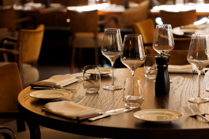Elegant table setting with wine glasses and cutlery at The Royal George restaurant in Tintern